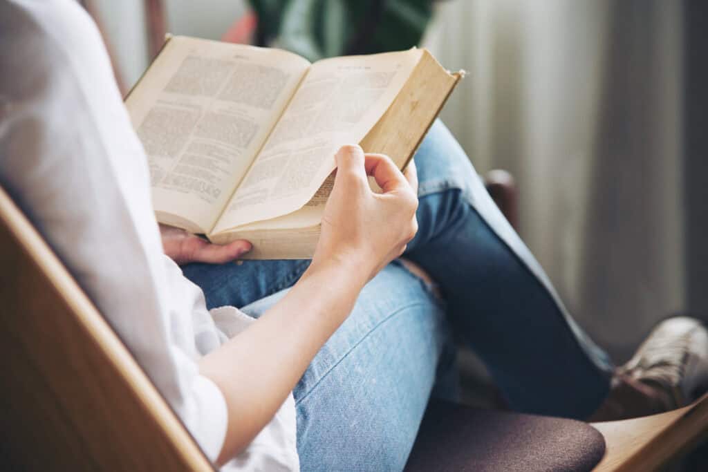 A woman reading the Bible to learn her God-given identity