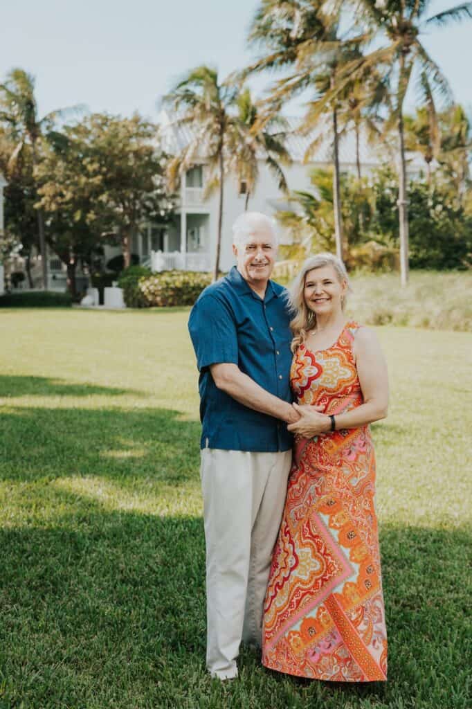 Catherine and Brian standing next to each other on a vibrant green lawn